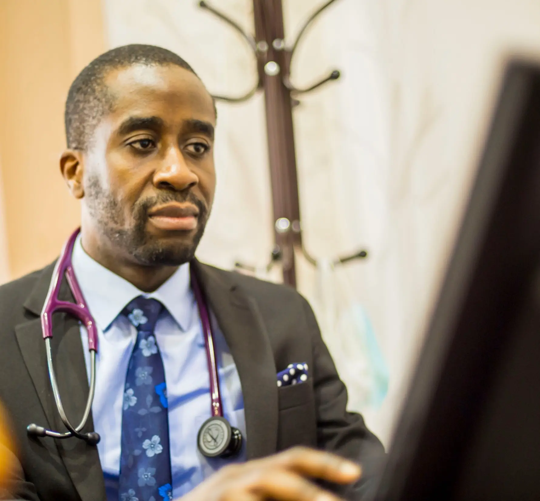 A Cardiocare clinician listening to a patient during a specialist consultation