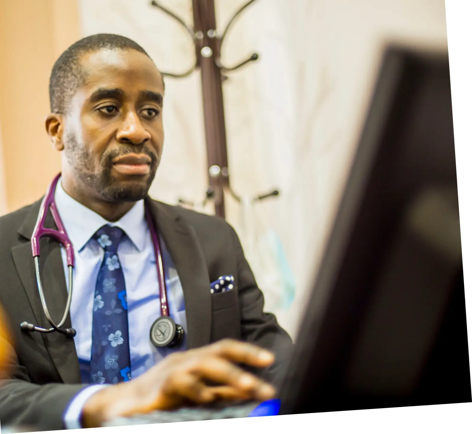 A Cardiocare specialist reviewing clinical information during a consultation